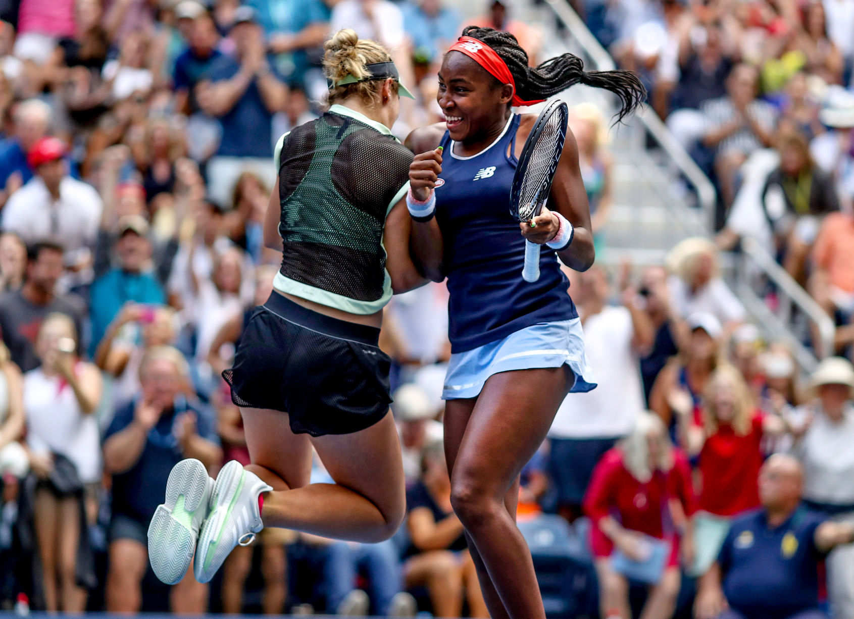 Coco Gauff, right, and her partner Catherine McNally celebrate